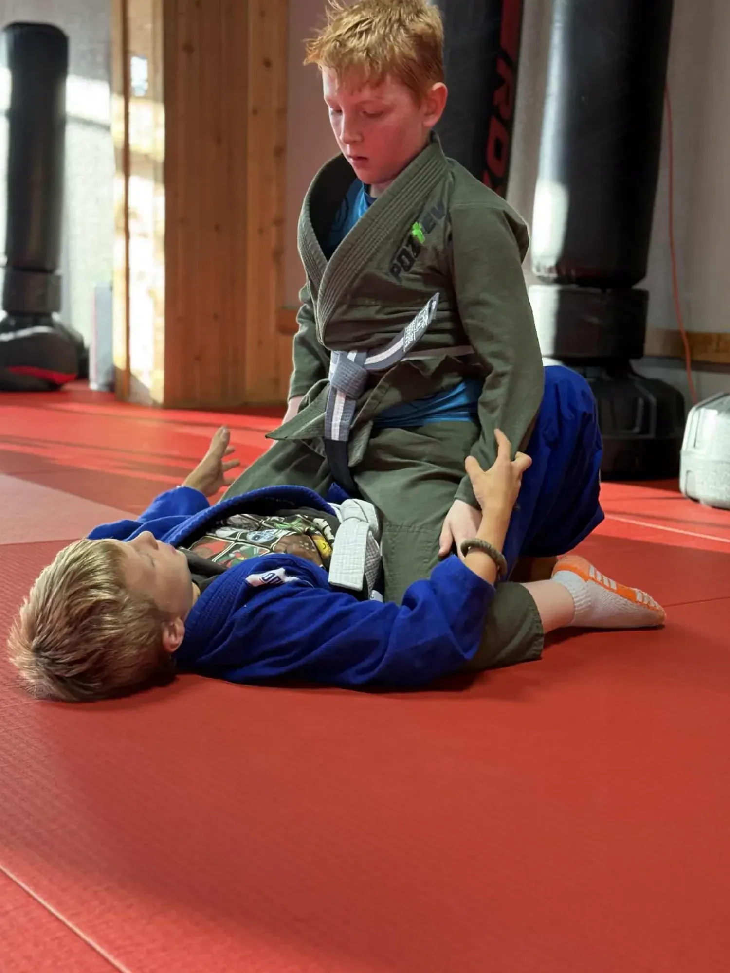 Young students practicing guard on the mat at Davis Martial Arts & Fitness in Pilot Point, TX