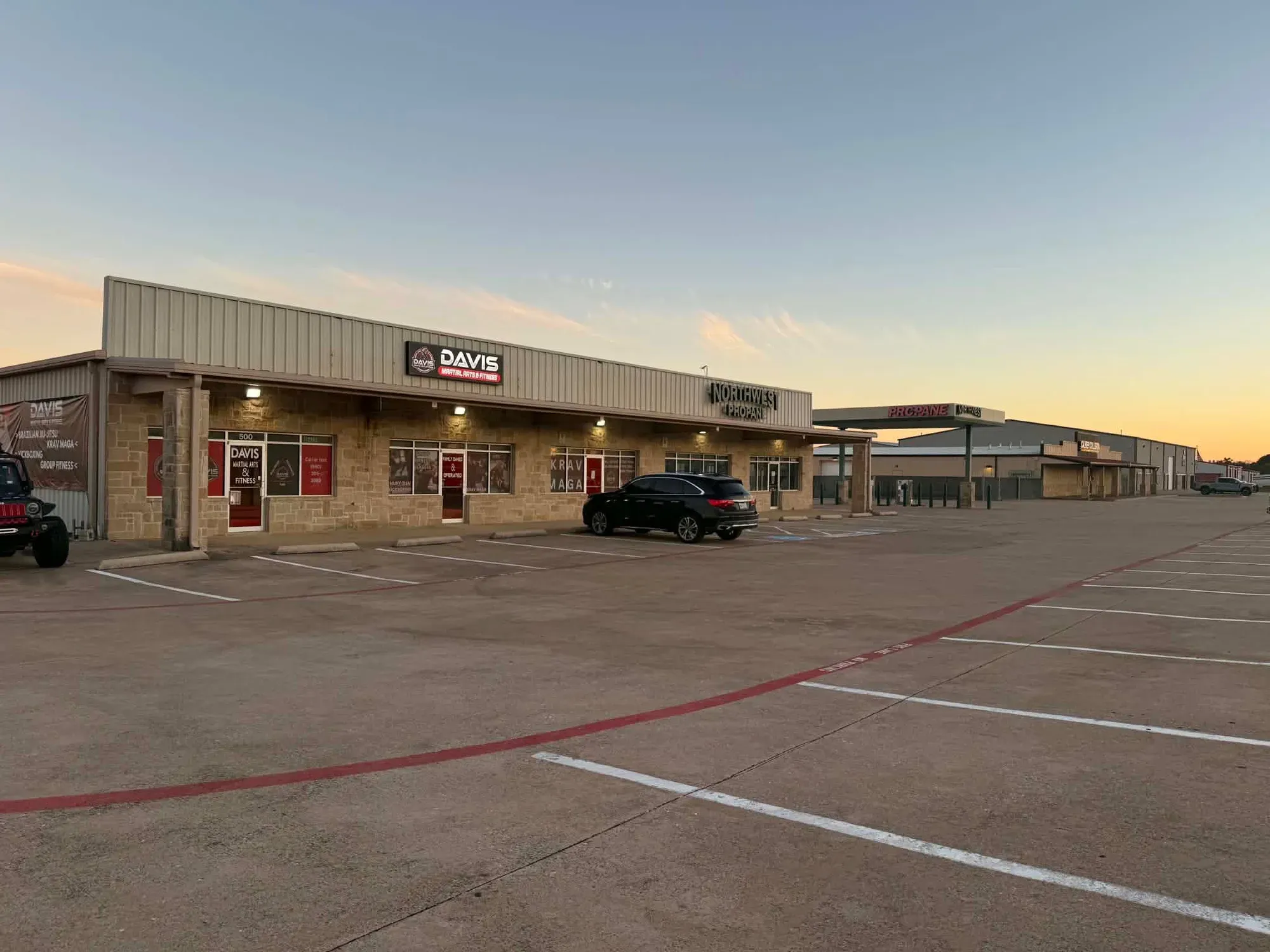 The Davis Martial Arts & Fitness building and storefront sign at 8620 US-377 in Pilot Point, TX